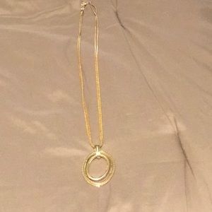 Gold pendant necklace. Hangs down 17”.